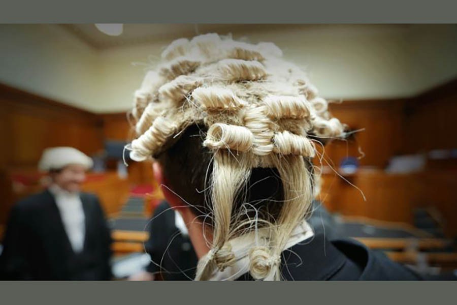 Back of a barrister's head. The Ministry of Justice is rushing to fix IT issues affecting courts across England. Photo: BBC