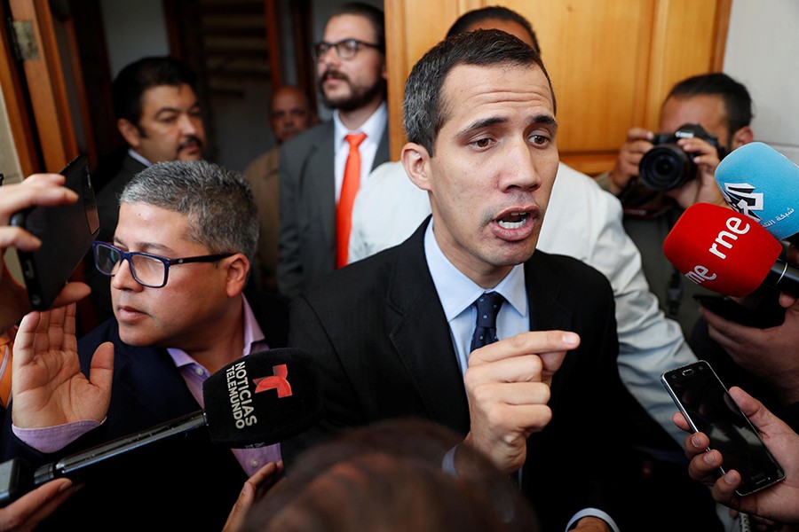 Venezuelan opposition leader and self-proclaimed interim president Juan Guaido talks to the media before a session of the Venezuela’s National Assembly in Caracas, Venezuela on January 29 — Reuters