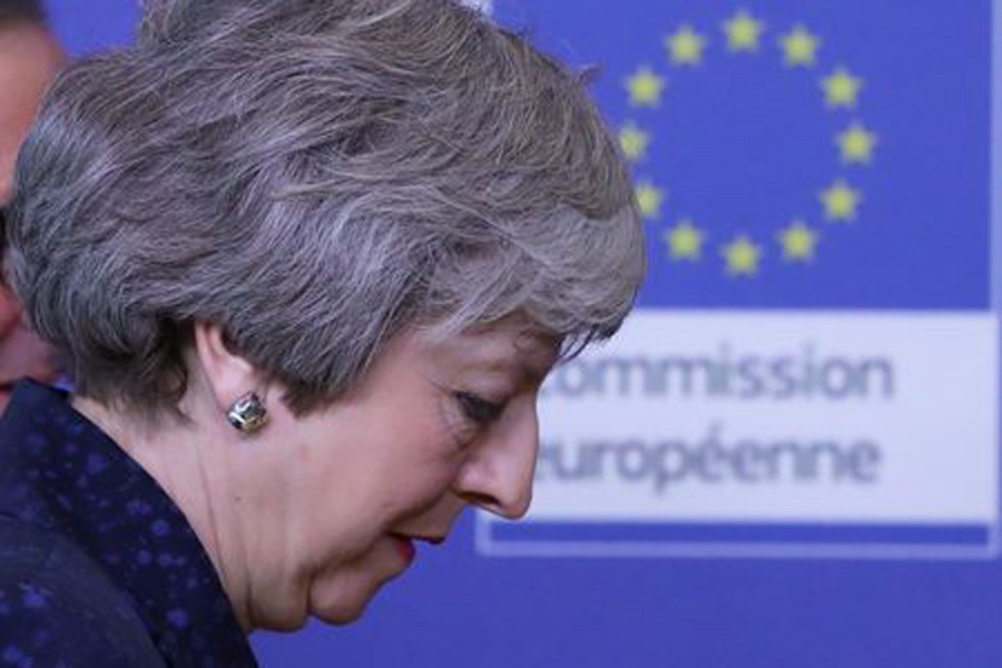 British Prime Minister Theresa May walks at the European Commission headquarters in Brussels, Belgium, February 7, 2019. Reuters