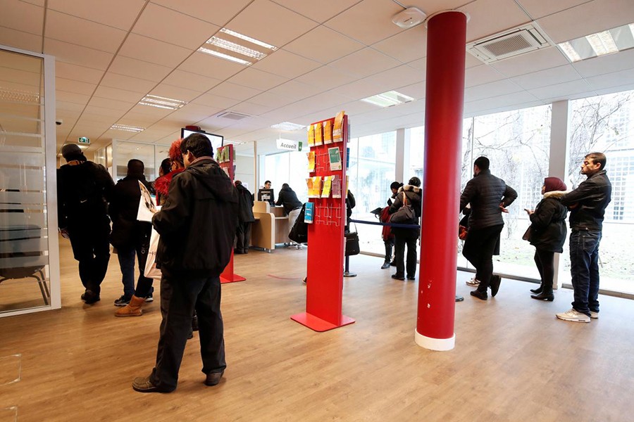 Job seekers wait to speak with staff at a National Agency for Employment (Pole Emploi) office in Aubervilliers, near Paris, France on December 20, 2017 — Reuters/File