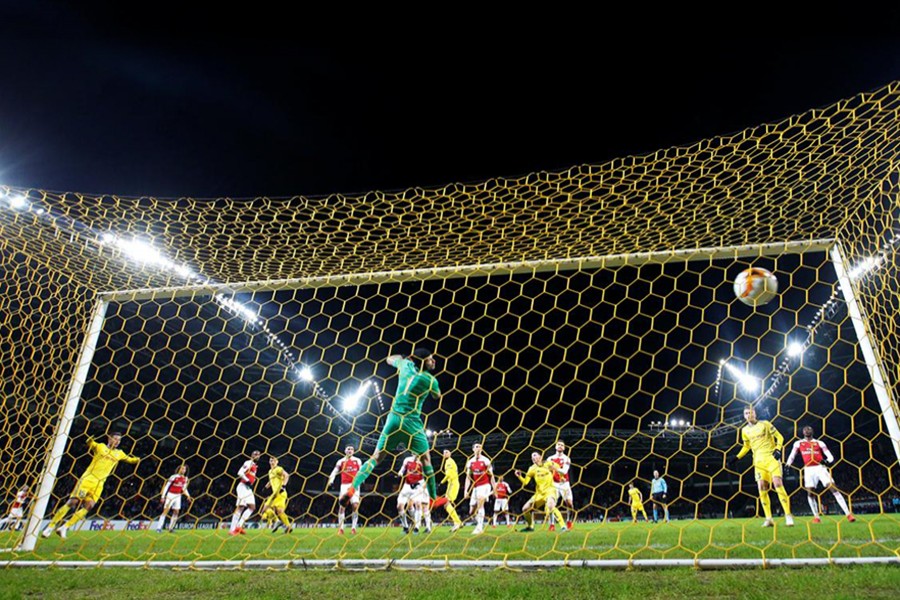 BATE Borisov's Stanislav Dragun scores their lone goal against Arsenal on Thursday — Reuters photo