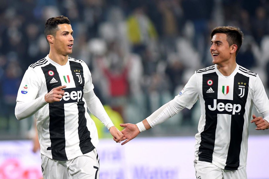 Soccer Football - Serie A - Juventus v Frosinone - Allianz Stadium, Turin, Italy - February 15, 2019 Juventus' Cristiano Ronaldo celebrates scoring their third goal with Paulo Dybala - REUTERS/Massimo Pinca