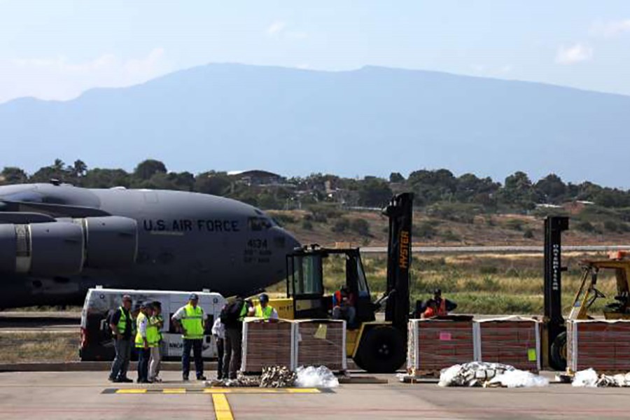 Humanitarian aid for Venezuela is carried after being unloaded from a US Air Force plane at Camilo Daza Airport in Cucuta on Saturday — Reuters photo