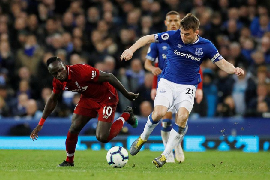 Liverpool's Sadio Mane in action with Everton's Seamus Coleman during Sunday's encounter at the Goodison Park — Reuters action image