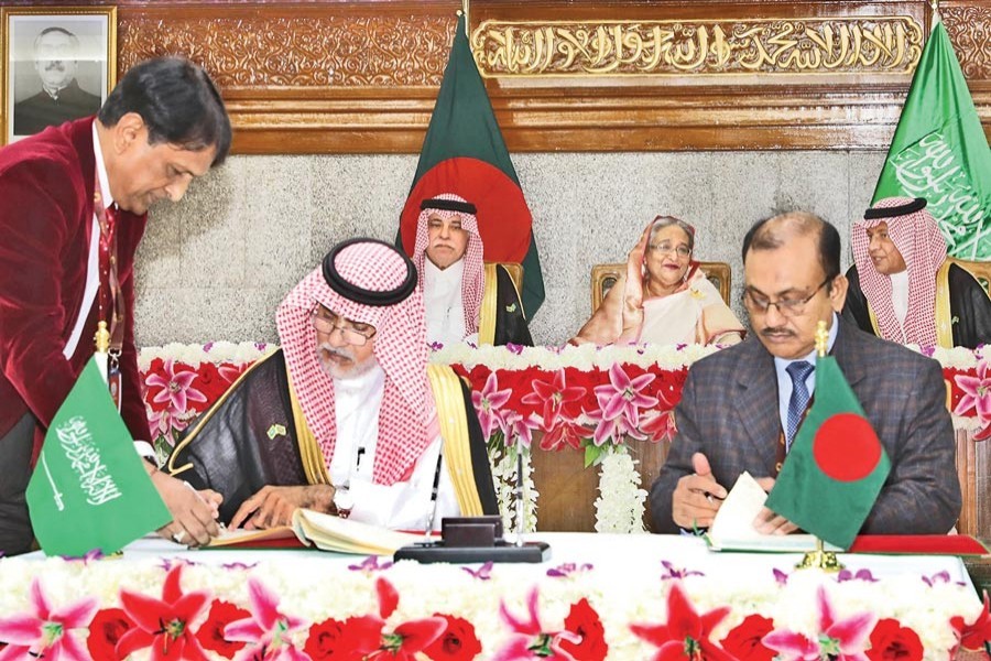 Bangladesh Prime Minister Sheikh Hasina (centre, back row) and Saudi Arabia Minister for Commerce and Investment Majid Bin Abdullah Al Qosaibi and Minister of Economy and Planning Mohammed bin Mezyed Altwaijri looking on as agreements were signed by parties concerned of the two countries at the Prime Minister's Office in the city on Thursday — Focus Bangla