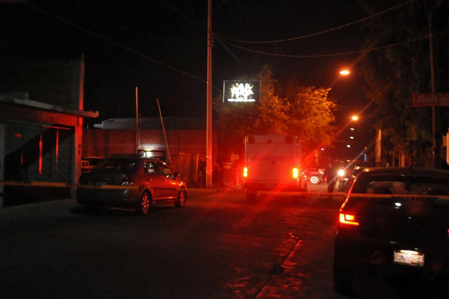 A general view shows cars near a bar La Playa Men's Club where at least 15 people were killed and another seven wounded in a shooting early on Saturday in the city of Salamanca, Mexico on March 9, 2019 — Reuters photo