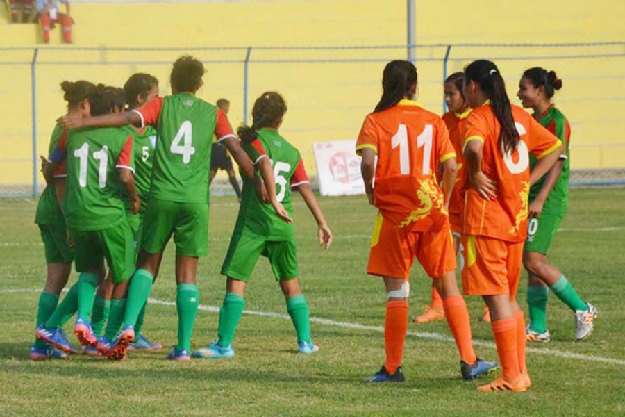 Bangladesh Women's Football team celebrating after beating Bhutan in SAFF Women's Championship at the Shahid Rangashala at Biratnagar in Nepal on Thursday	— bdnews24.com