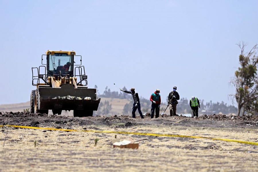 Villagers gather wreckages of the Ethiopian Airlines Flight ET 302 plane crash, near the town Bishoftu, near Addis Ababa, Ethiopia March 15, 2019 — Reuters photo