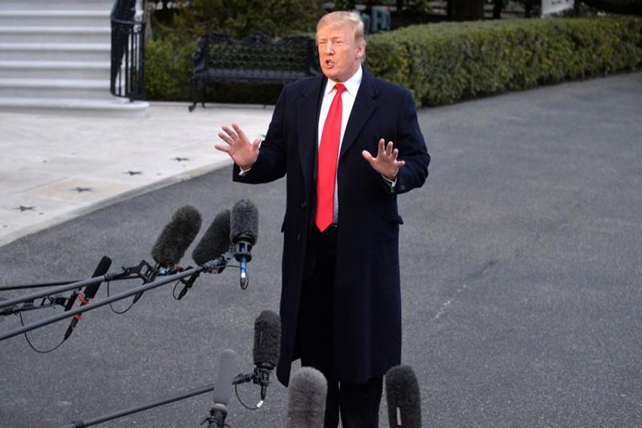 President Donald Trump reacts as he returns to the White House after Attorney General William Barr reported to congressional leaders on the submission of the report of Special Counsel Robert Mueller in Washington, March 24, 2019. Reuters