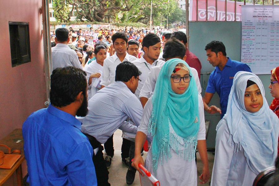 Students being checked while entering an HSC exam centre in Dhaka city — Focus Bangla/Files