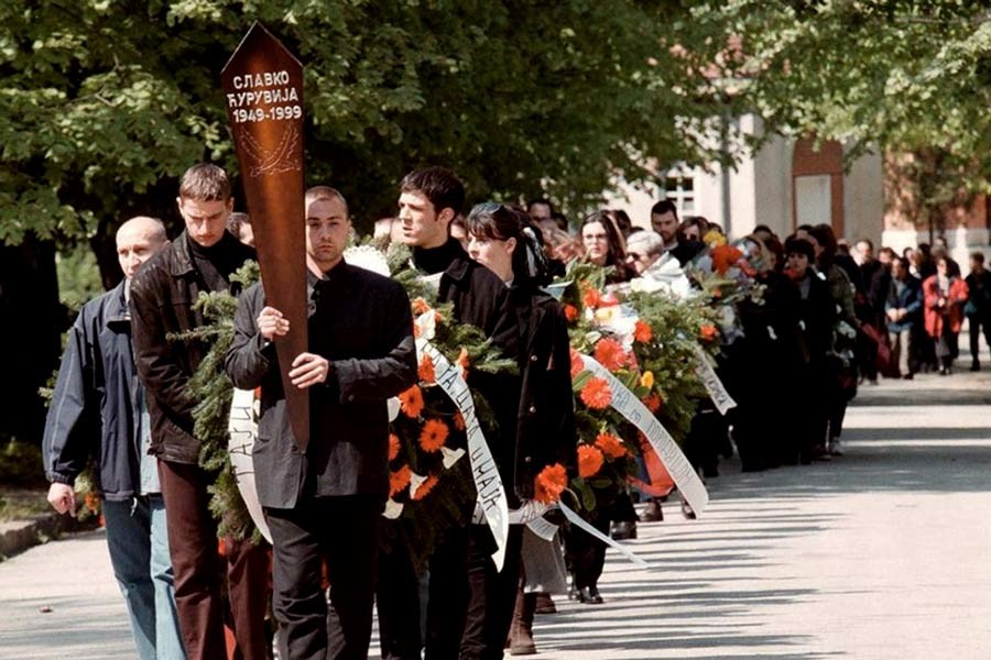 File Photo: A funeral procession for prominent Serbian opposition journalist Slavko Curuvija, owner of the daily Dnevni Telegraf, who was killed in Belgrade on April 11. Belgrade, Serbia, April 14, 1999. -Reuters Photo