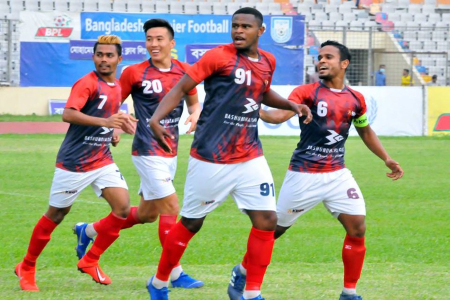 Bashundhara Kings players celebrating after scoring a goal against Dhaka Mohammedan SC at the Bangabandhu National Stadium in the city on Sunday