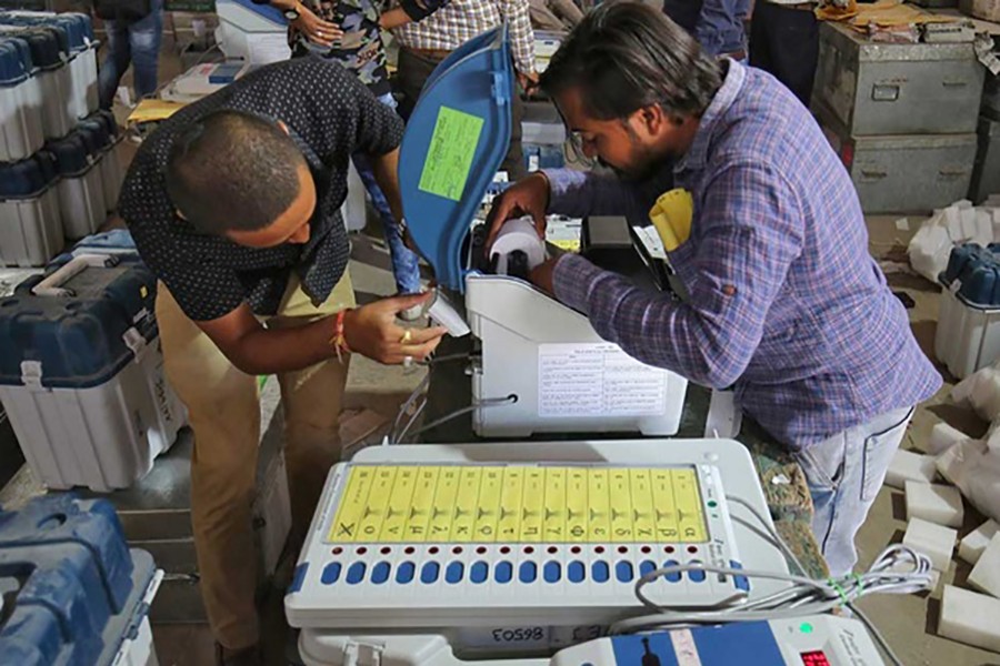 Election staff prepare Voter Verifiable Paper Audit Trail (VVPAT) machines and Electronic Voting Machines (EVM) ahead of India's general election at a warehouse in Ahmedabad, India on Mar 6, 2019 — Reuters/Files