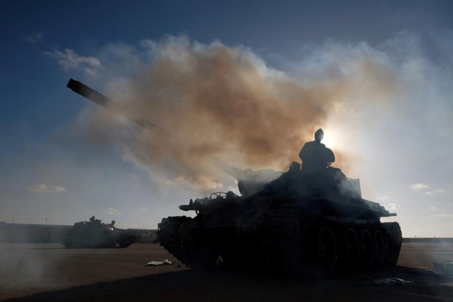 Members of Libyan National Army (LNA) commanded by Khalifa Haftar, get ready before heading out of Benghazi to reinforce the troops advancing to Tripoli, in Benghazi, Libya April 13, 2019. REUTERS/Esam Omran Al-Fetori/File Photo