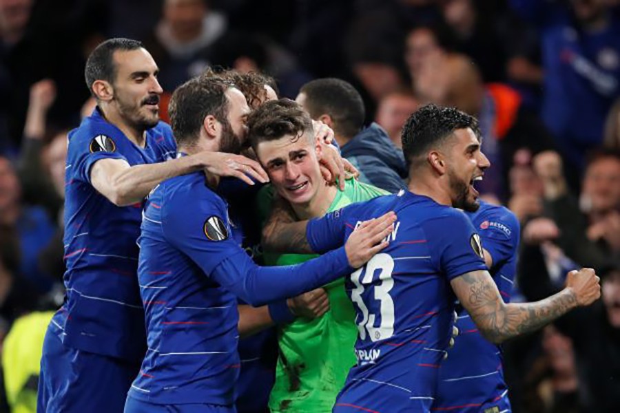 Chelsea's Kepa Arrizabalaga, Davide Zappacosta, Gonzalo Higuain, and Emerson Palmieri celebrate winning the penalty shootout — Reuters action image