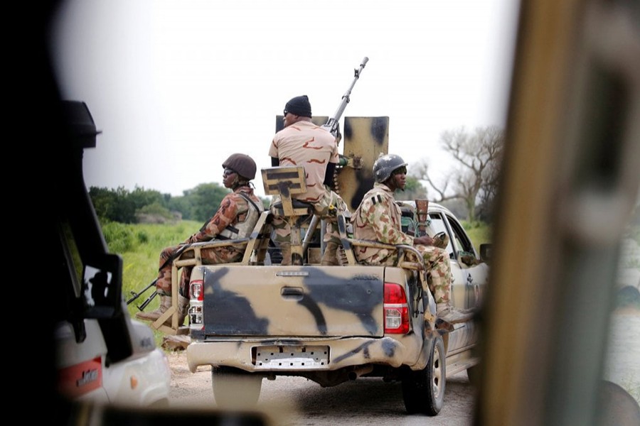 A Nigerian army convoy vehicle drives ahead with an anti-aircraft gun, on its way to Bama, Borno State, Nigeria — Reuters/Files