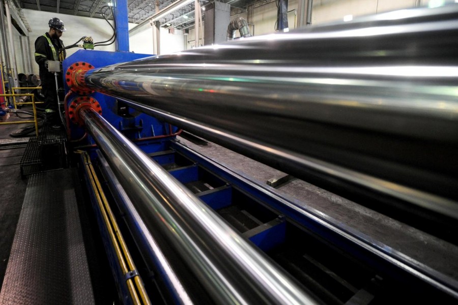 Workers are seen at at Bri-Steel Manufacturing, a manufacturer and distributer of seamless steel pipes, in Edmonton, Alberta, Canada, June 21, 2018 - REUTERS/Candace Elliott