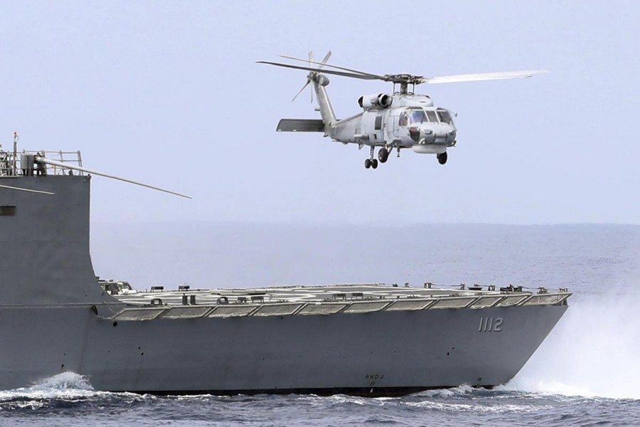 A Taiwan navy S70 helicopter takes off from the stern of a Perry-class frigate during a naval exercise off Hualien County, eastern Taiwan, Wednesday, May 22, 2019 - Chiang Ying-ying/Associated Press