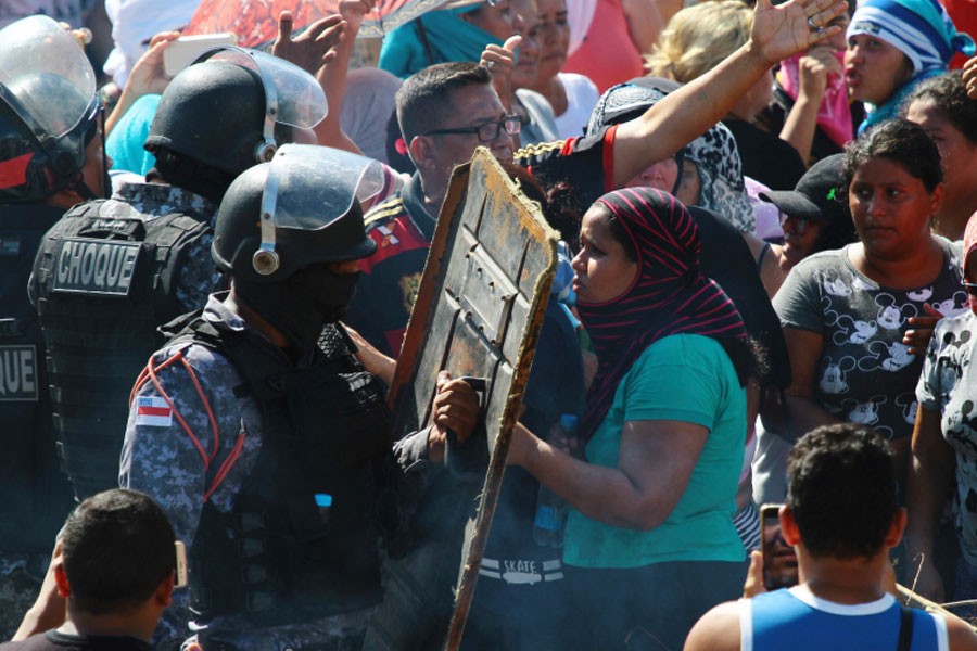 Relatives argue with police for more information outside the Anisio Jobim Prison Complex where a deadly riot erupted among inmates in Manaus in the northern state of Amazonas, Brazil, Sunday, May 26, 2019 - AP Photo/Edmar Barros