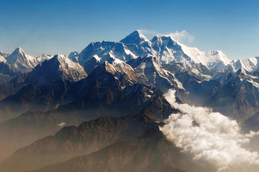 Wind blows snow off the summit at dusk of the world's highest mountain Mount Everest, also known as Qomolangma, in the Tibet Autonomous Region May 5, 2008 - REUTERS/David Gray/File Photo