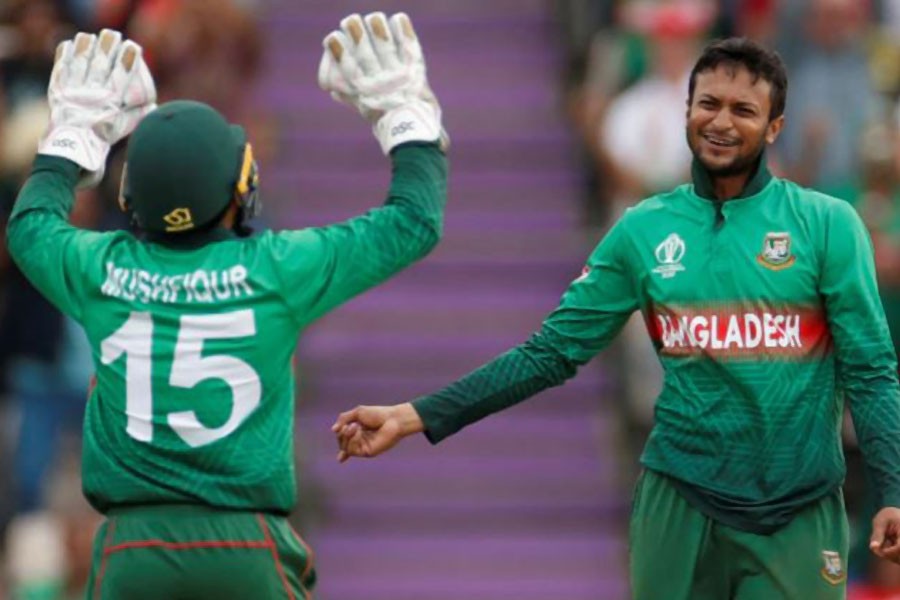 Bangladesh ace all-rounder Shakib Al Hasan and wicketkeeper Mushfiqur Rahim seen celebrating together in this undated Reuters photo