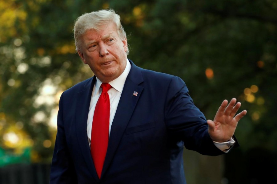 US President Donald Trump waves as he walks on the South Lawn of the White House upon his return to Washington from South Korea, US, June 30, 2019. Reuters