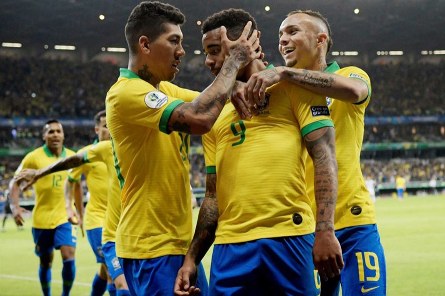 Brazil players congratulate Gabriel Jesus on his opener against Argentina — Reuters photo