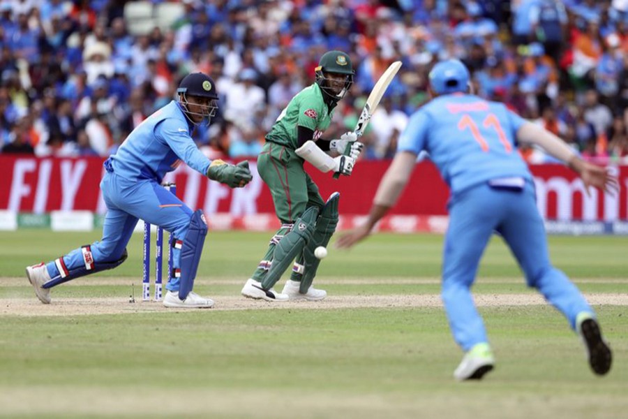 Bangladesh's Shakib Al Hasan, centre, bats during the Cricket World Cup match between Bangladesh and India at Birmingham's Edgbaston, England on Tuesday, July 2 — AP photo