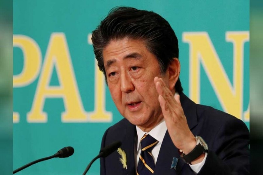 Japan PM Abe's coalition on track to win solid majority in election