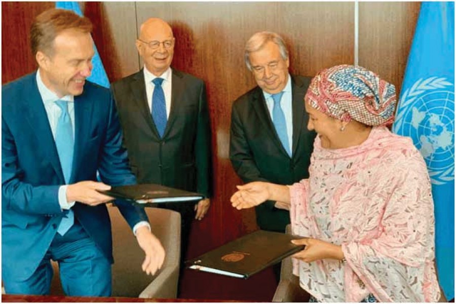 Amina Mohammed, right, the deputy secretary-general of the UN, signed a partnership agreement with the World Economic Forum, led by Borge Brende, left, to speed up progress on the Sustainable Development Goals. António Guterres, the UN secretary-general (behind Mohammed) and Klaus Schwab, the Forum's chief executive, joined the ceremony in June.