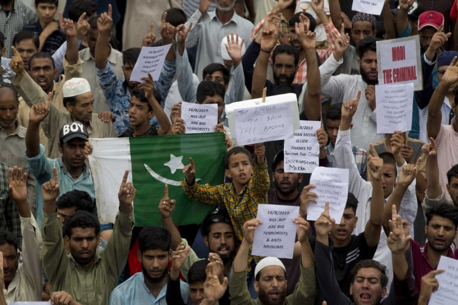 Kashmiri Muslims hold placards and shout pro-freedom slogans during a demonstration after Friday prayers amid curfew like restrictions in Srinagar, India, Friday, Aug. 16, 2019. Hundreds of Kashmiris held a street protest in the Indian-controlled Kashmir even as India's government assured the Supreme Court on Friday that the situation in disputed Kashmir is being reviewed daily and unprecedented security restrictions will be removed over the next few days, an attorney said after the court heard challenges to India's moves. (AP Photo/Dar Yasin)