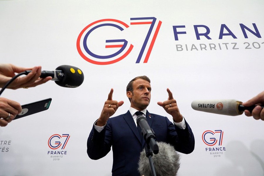 France's President Emmanuel Macron gestures as he speaks to the press after a plenary session at the Bellevue centre in Biarritz, France on August 25, 2019 — Reuters photo