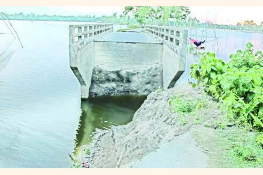 The recent flood damaged the culvert over the Goborchapa Beel under Sonatola upzila of Bogura district   	— FE Photo