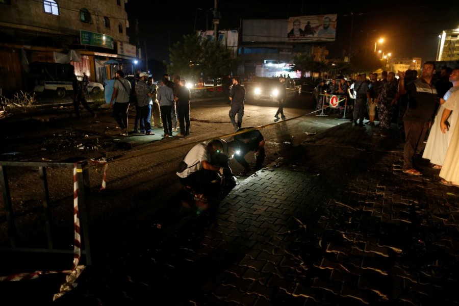 Palestinians check the scene following an explosion in Gaza City August 27, 2019. REUTERS/Mohammed Salem