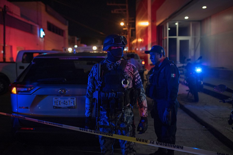 Federal forces keep watch at a scene following a deadly fire at a bar in Coatzacoalcos, Mexico on August 28, 2019 — Reuters photo