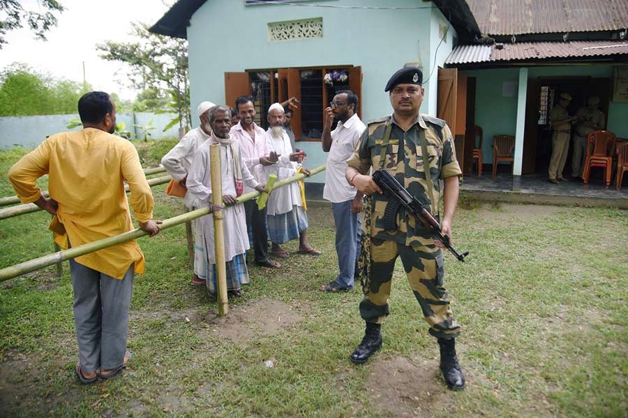 People stand in a queue to check their names on the draft list of the National Register of Citizens (NRC) outside an NRC centre in Rupohi village, Nagaon district, northeastern state of Assam, India on August 31, 2019.             —Photo: Reuters