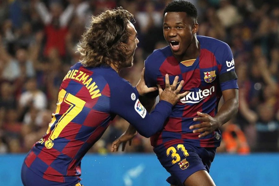 Barcelona’s Ansu Fati celebrates scoring their first goal with teammate Antoine Griezmann during the clash against Valencia at Camp Nou in Barcelona on September 14, 2019 — Reuters photo