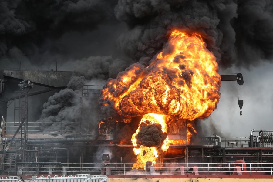 Fire from a vessel is seen at a port in Ulsan, South Korea, September 28, 2019. Yonhap via REUTERS