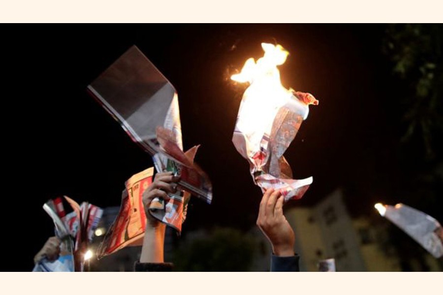 People protesting on the street following the release of a revised vote count     	— Reuters