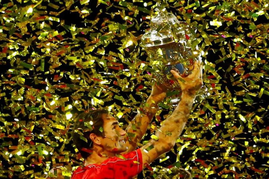 Switzerland's Roger Federer celebrates with the Swiss Indoors Basel trophy after winning the final against Australia's Alex de Minaur — Reuters photo