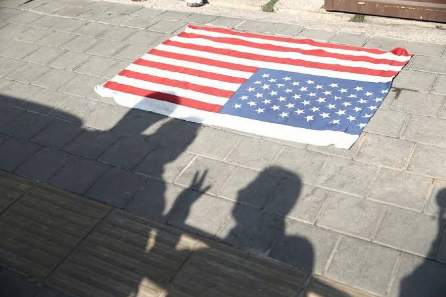 A flag of US is seen on the ground in front of former US embassy in Tehran, Iran November 2, 2019. Nazanin Tabatabaee/WANA (West Asia News Agency) via REUTERS