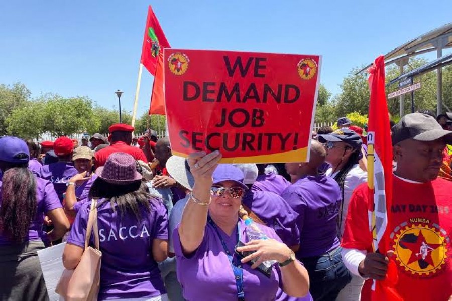 Workers of South African Airways (SAA) hold placards during a strike over wages and job cuts at SAA headquarters in Kempton Park, South Africa, November 15, 2019. REUTERS/Siyabonga Sishi