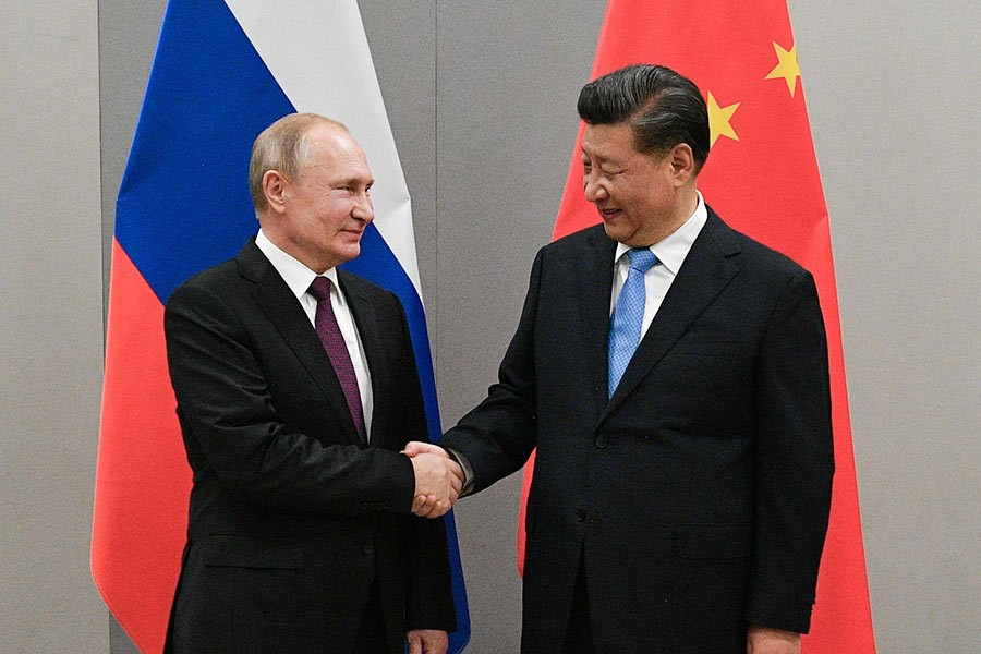 Russian President Vladimir Putin shaking hands with Chinese President Xi Jinping during their meeting on the sideline of the 11th edition of the BRICS Summit, in Brasilia, Brazil last month. -Reuters Photo