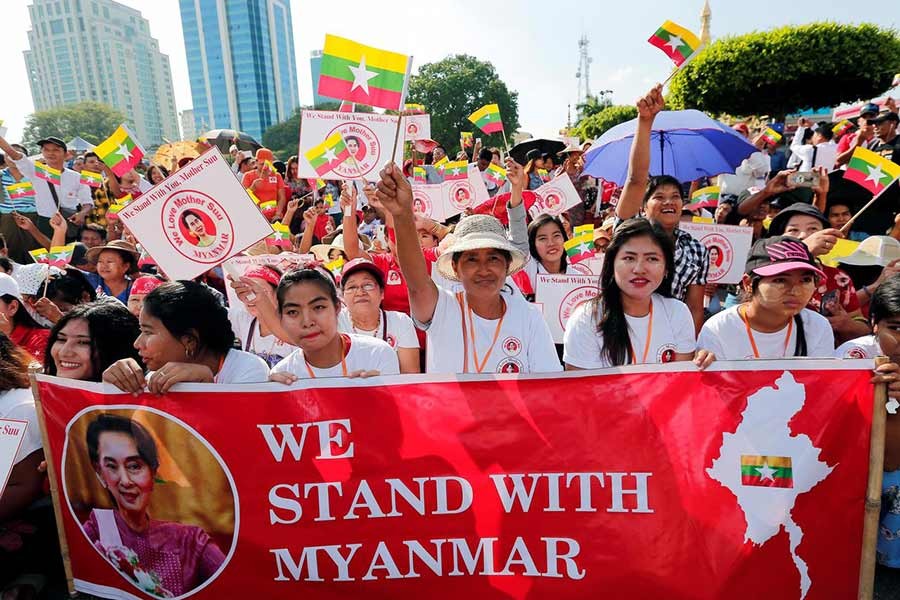 Suu Kyi’s supporters hold rally as genocide trial set to begin