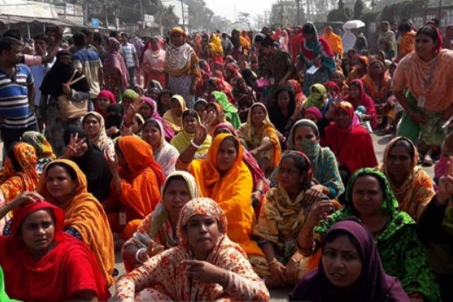 RMG workers block Dhaka road over back pay