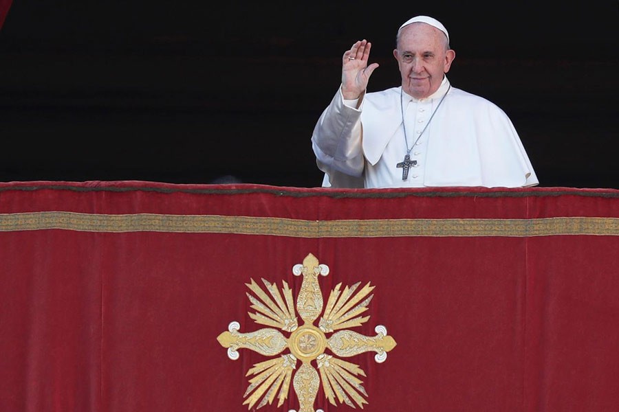 Pope Francis gesturing as he arrives to deliver the 'Urbi et Orbi' Christmas Day message from the main balcony of St. Peter's Basilica at the Vatican on Wednesday. -Reuters Photo