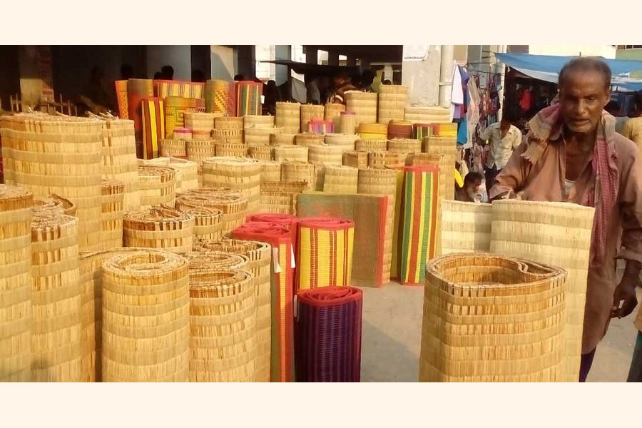 A mele mat seller waiting for buyers at his shop at a market in Satkhira district	— UNB Photo