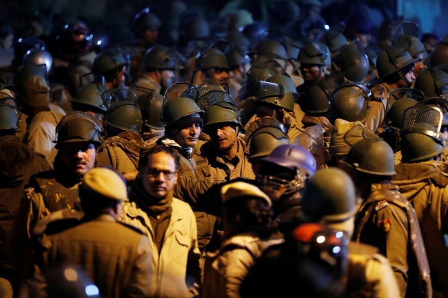 FILE PHOTO: Police in riot gear stand guard inside the Jawaharlal Nehru University (JNU) after clashes between students in New Delhi, India, January 5, 2020. REUTERS/Adnan Abidi