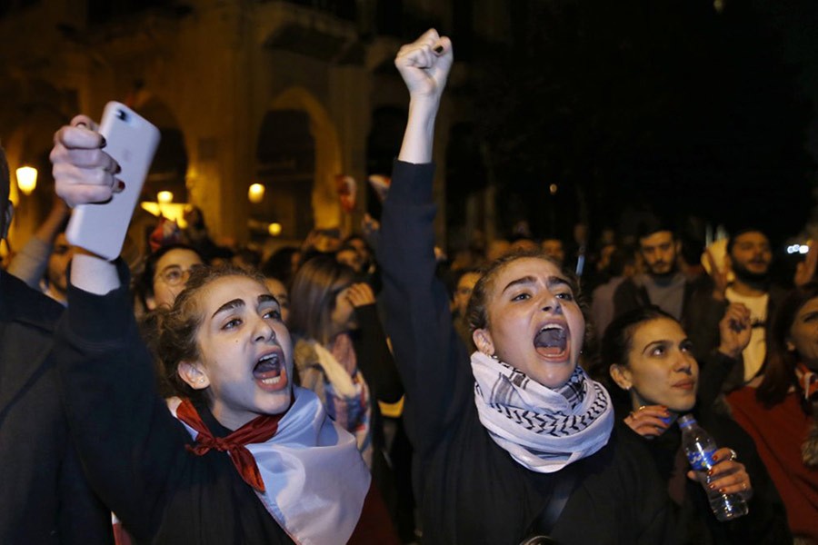 Protesters chanting slogans during protests against the Lebanese political class, in downtown Beirut, Lebanon in last month. -AP Photo