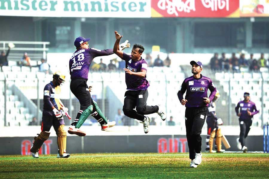 Chattogram Challengers' Rubel Hossain celebrating with teammate Nurul Hasan Sohan after getting the wicket of Dhaka Platoon's Tamim Iqbal during the BBPL match at Sher-e-Bangla National Cricket Stadium in the city on Monday	— BCB